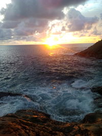 Scenic view of sea against sky during sunset