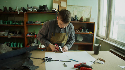 Man working on table at home