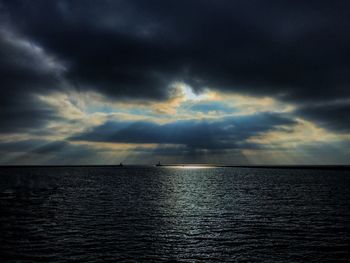 Scenic view of sea against dramatic sky