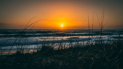 Scenic view of sea against sky during sunset