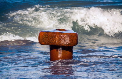 Lifeguard hut on rock in sea