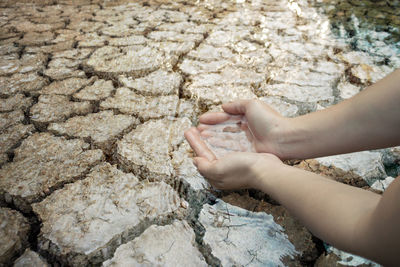 Close-up of woman hand with tattoo in water