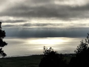 Scenic view of sea against sky at sunset