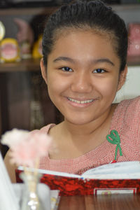 Close-up portrait of a smiling young woman