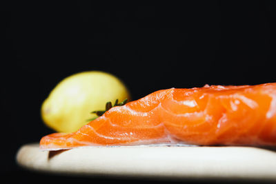 Close-up of fruit slices against black background