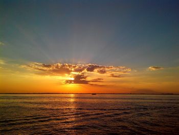 Scenic view of sea at sunset