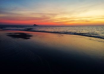 Scenic view of sea against dramatic sky