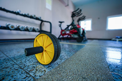 Close-up of yellow toy car on floor