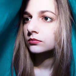 Close-up of young woman looking away