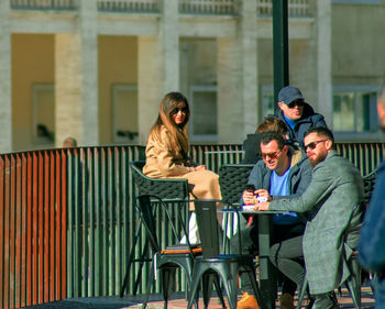 Young couple sitting on table