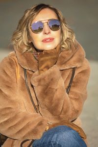 Portrait of young woman wearing sunglasses