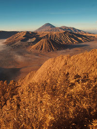 View of volcanic landscape against sky