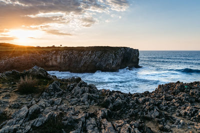 Scenic view of sea against sky during sunset