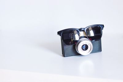 Close-up of camera against white background