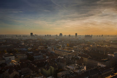 High angle view of city buildings during sunset