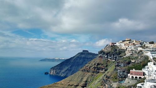 Panoramic view of sea and buildings against sky