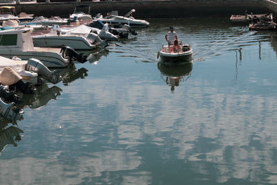 Group of people on boat in lake