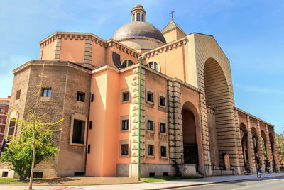 Low angle view of church against blue sky