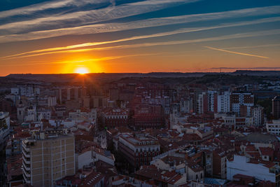 High angle view of buildings against sky during sunset