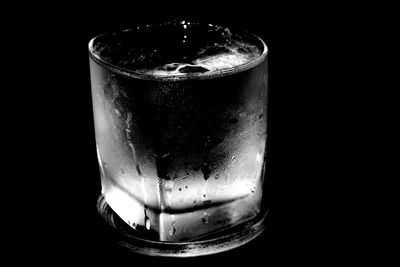 Close-up of drink over black background