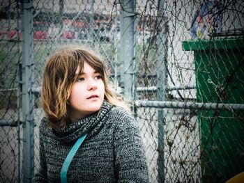 Portrait of girl sitting outdoors