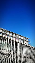 Low angle view of built structure against blue sky