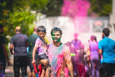 Portrait of man with face paint standing outdoors