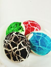 Close-up of multi colored candies against white background