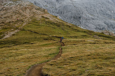 Man walking on mountain road