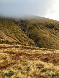 Stream running down from the clouds over ben nevis