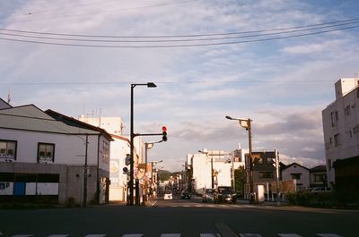 Road in city against sky