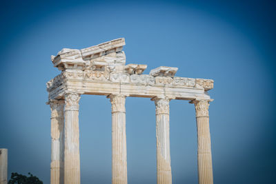 Low angle view of historical building against blue sky