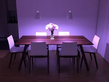 High angle view of chairs arranged by table at home