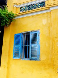 Low angle view of closed window of building