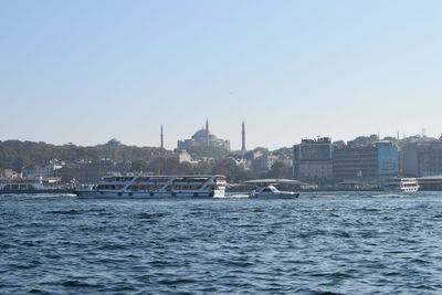 View of buildings in town against clear sky