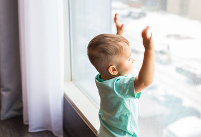 Boy looking at camera at home