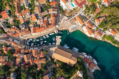 High angle view of townscape by swimming pool in city