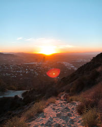 Scenic view of landscape against sky during sunset