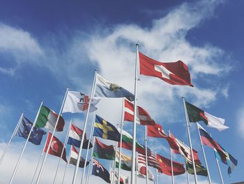 Low angle view of flag flags against sky