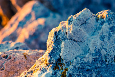Close-up of rock against blue sky