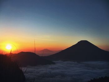 Scenic view of mountains at sunset