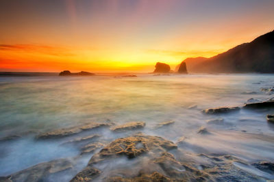 Scenic view of sea against sky during sunset