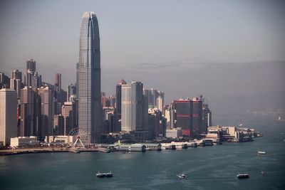 Skyscrapers against sky facing victoria harbour 