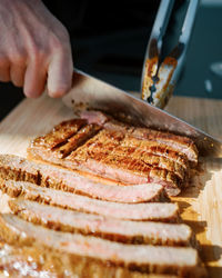 Close-up of person preparing food on table