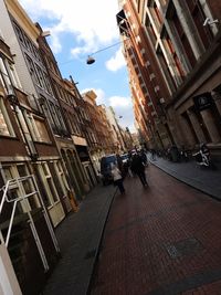 Road amidst buildings in city