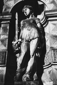 Low angle view of statue against temple