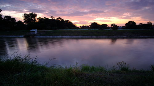 Scenic view of lake against sky during sunset