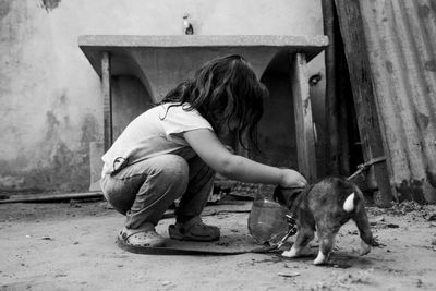 Portrait of lovely girl playing with her dog