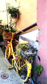 Bicycle parked against wall