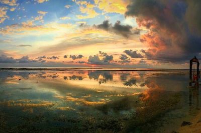 Scenic view of calm lake at sunset